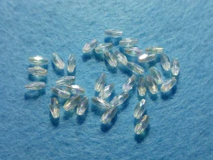 Broušené oválky 11 x 4 mm - transparentní, AB efekt