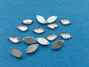 Našívací broušené korálky 15 x 7 mm - transparentní